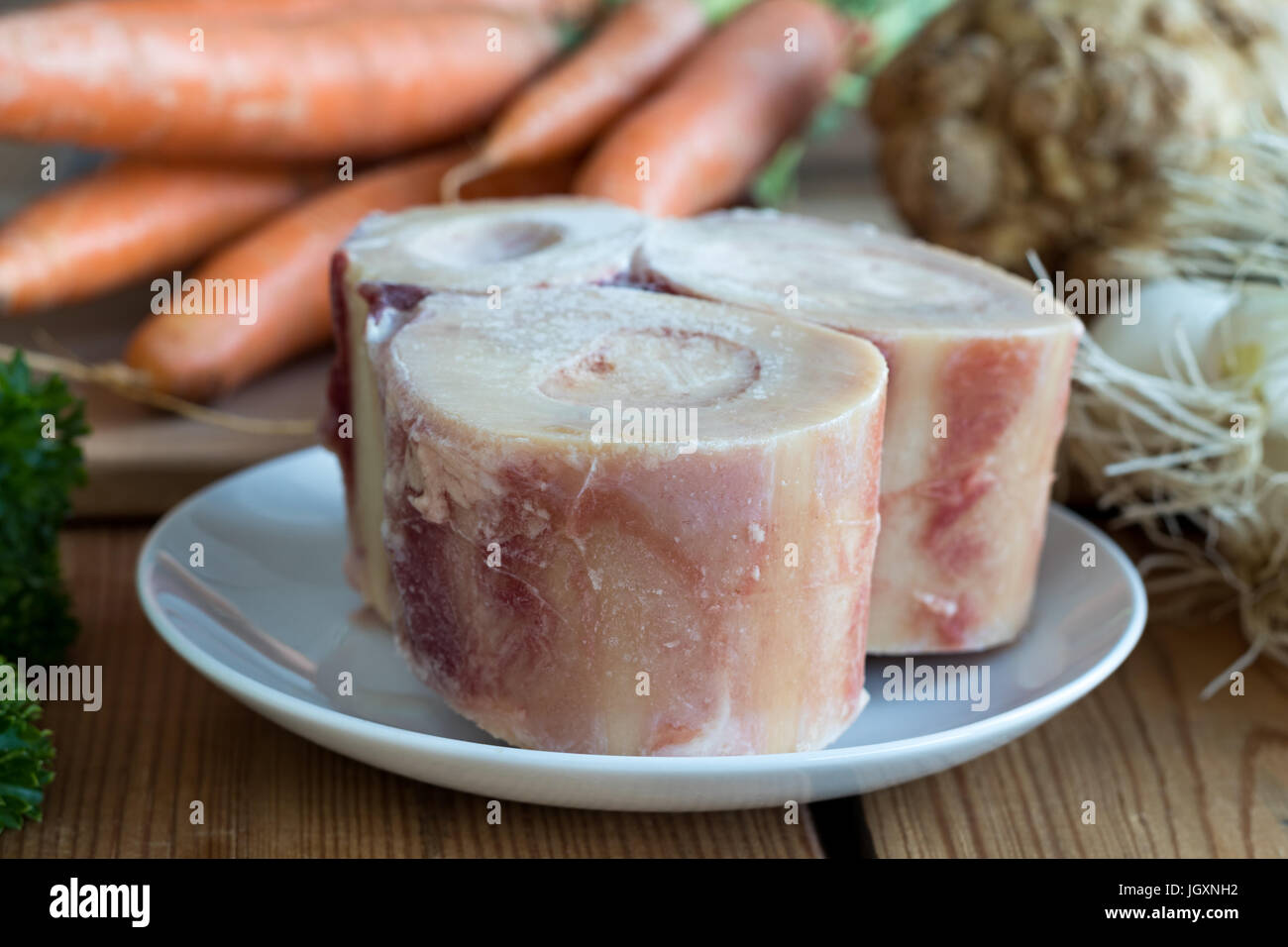 Ingredients for making a beef bone broth marrow bones, carrots