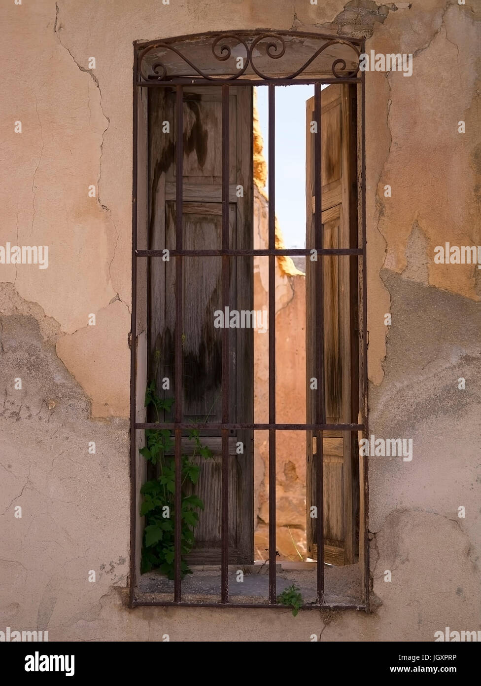 Looking through a rustic Spanish window Stock Photo