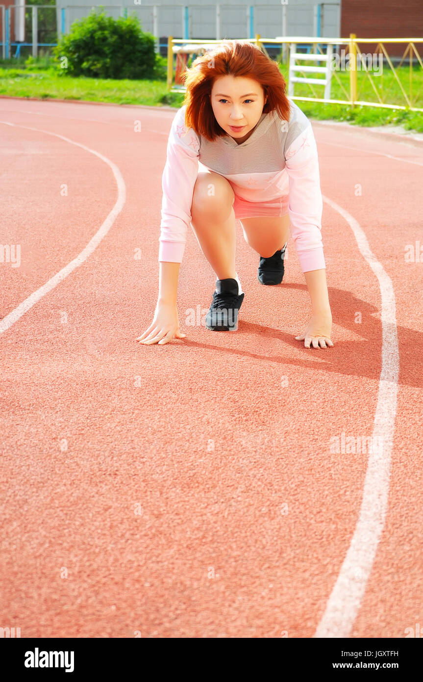 Young girl running on track hires stock photography and images Alamy