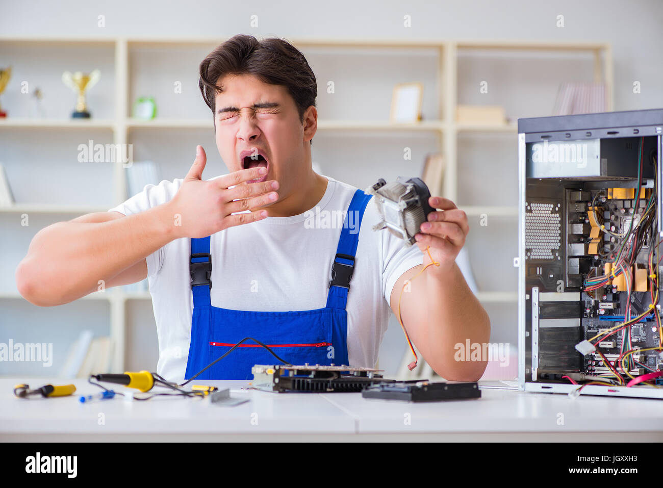 Computer Rebort Man Computer repairman repairing desktop computer Stock Photo - Alamy
