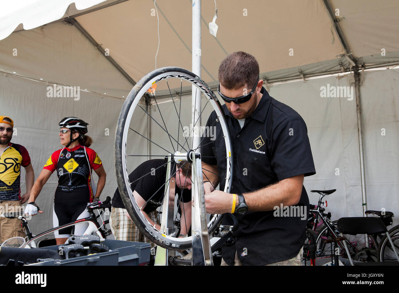 Bicycle mechanic truing a bike wheel - USA Stock Photo