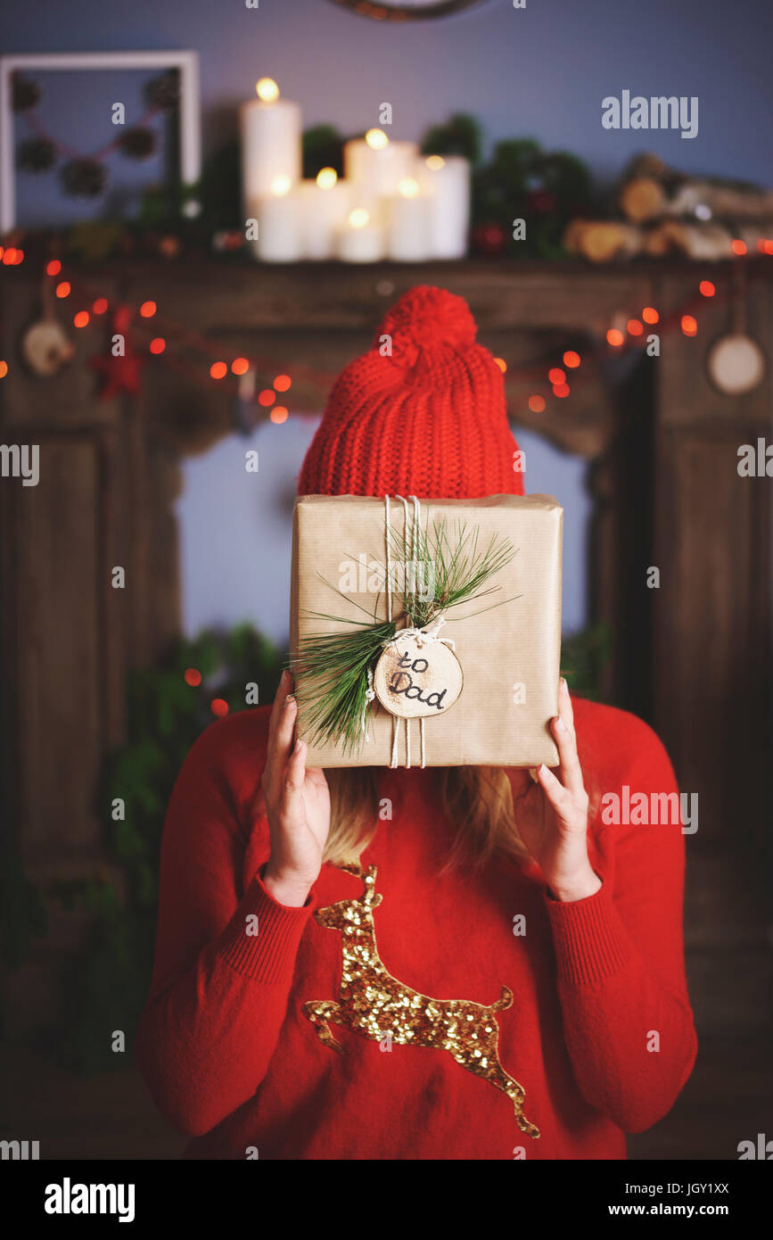 https://c8.alamy.com/comp/JGY1XX/woman-holding-christmas-present-in-front-of-face-JGY1XX.jpg