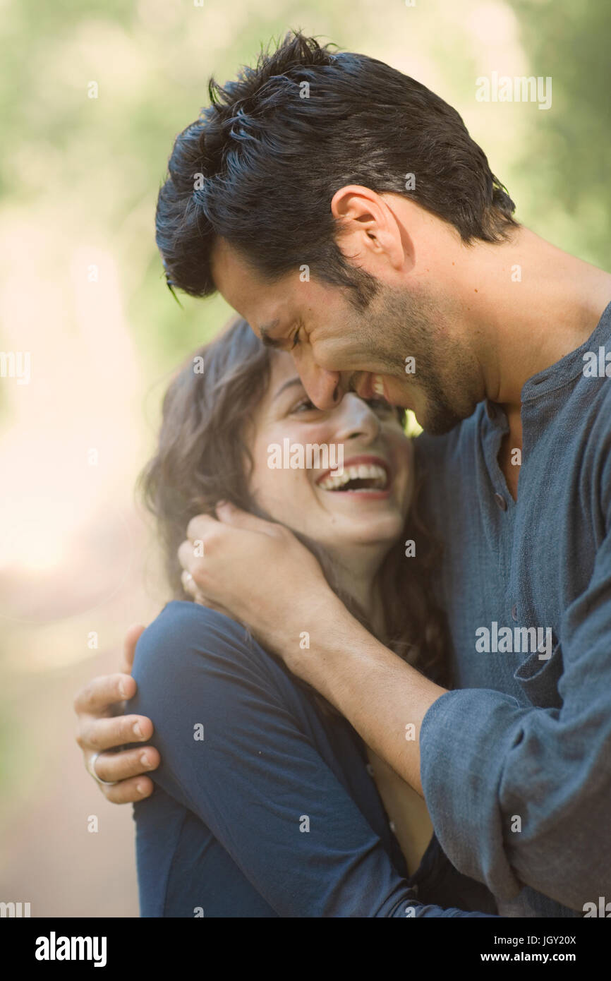 Hugging Cuple Smiling woman hugging white hi-res stock photography and images - Alamy