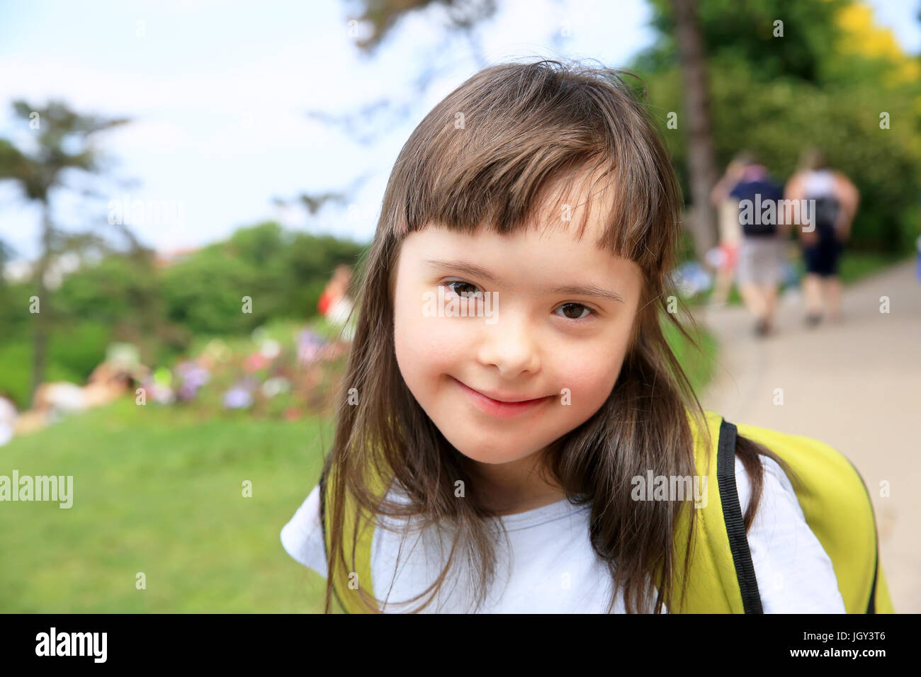 Portrait of little girl smiling outside Stock Photo - Alamy