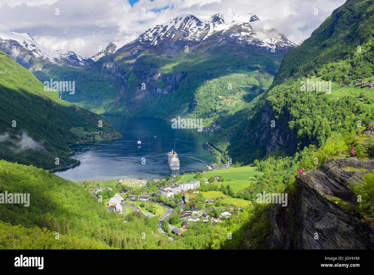 High view over Geirangerfjorden surrounded by snowcapped mountains in summer. Geiranger, Sunnmøre region, Møre og Romsdal county, Norway, Scandinavia Stock Photo