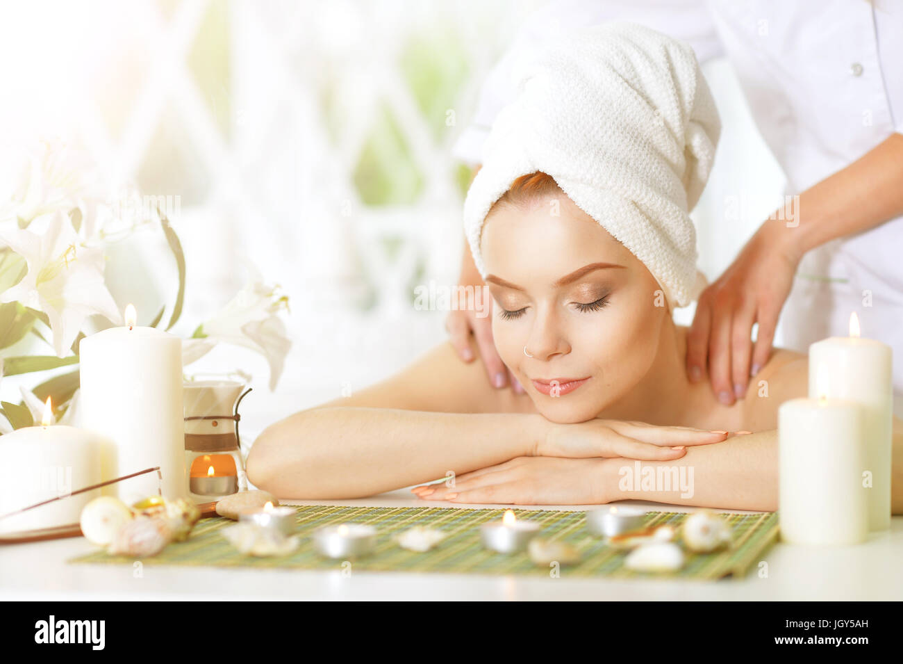 girl lying down on a massage bed Stock Photo Alamy