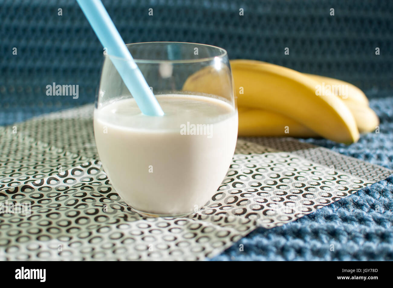 Healthy Food Banana Smoothies Milkshake And Ripe Bananas On Blue Fabric Knitted Background Stock Photo Alamy
