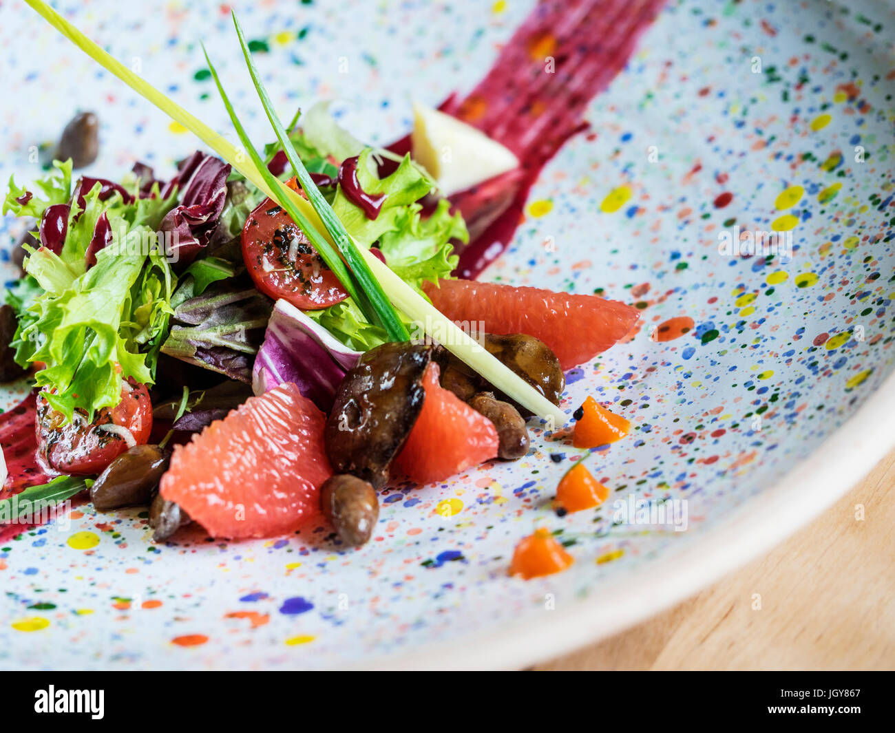 Salad with quail liver and grapefruit. Selective focus Stock Photo Alamy