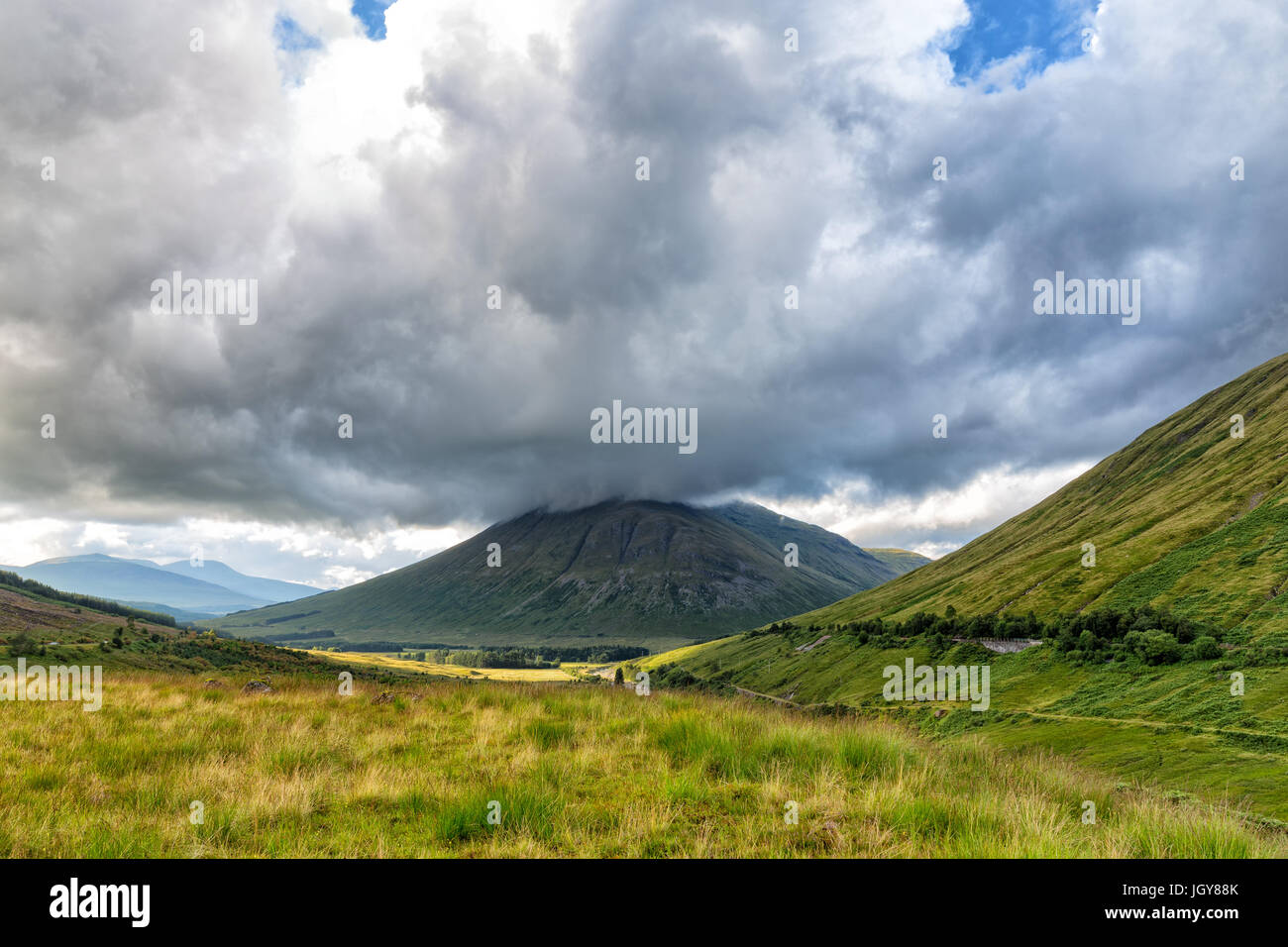Dramatic clouds over Beinn Dorain in Scotland. Stock Photo