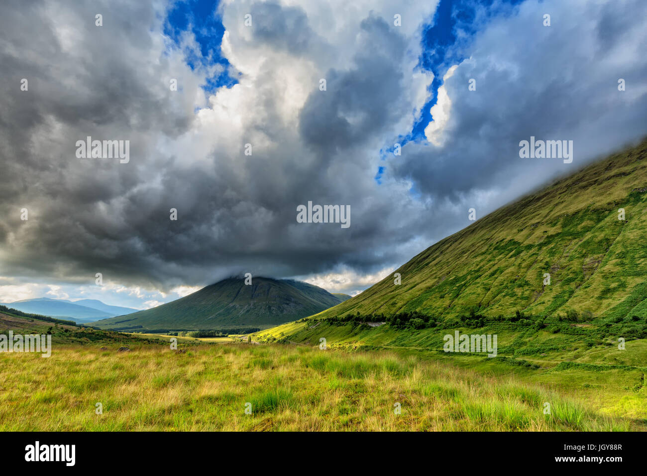 Dramatic Clouds over Beinn Dorain and Beinn Odhar Mountains in Scotland. Stock Photo