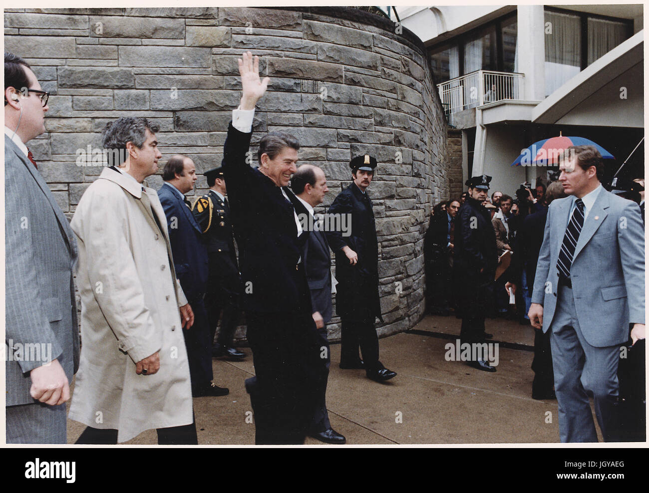 President Reagan waving to crowds immediately before being shot in an assassination attempt, Washington, DC Stock Photo