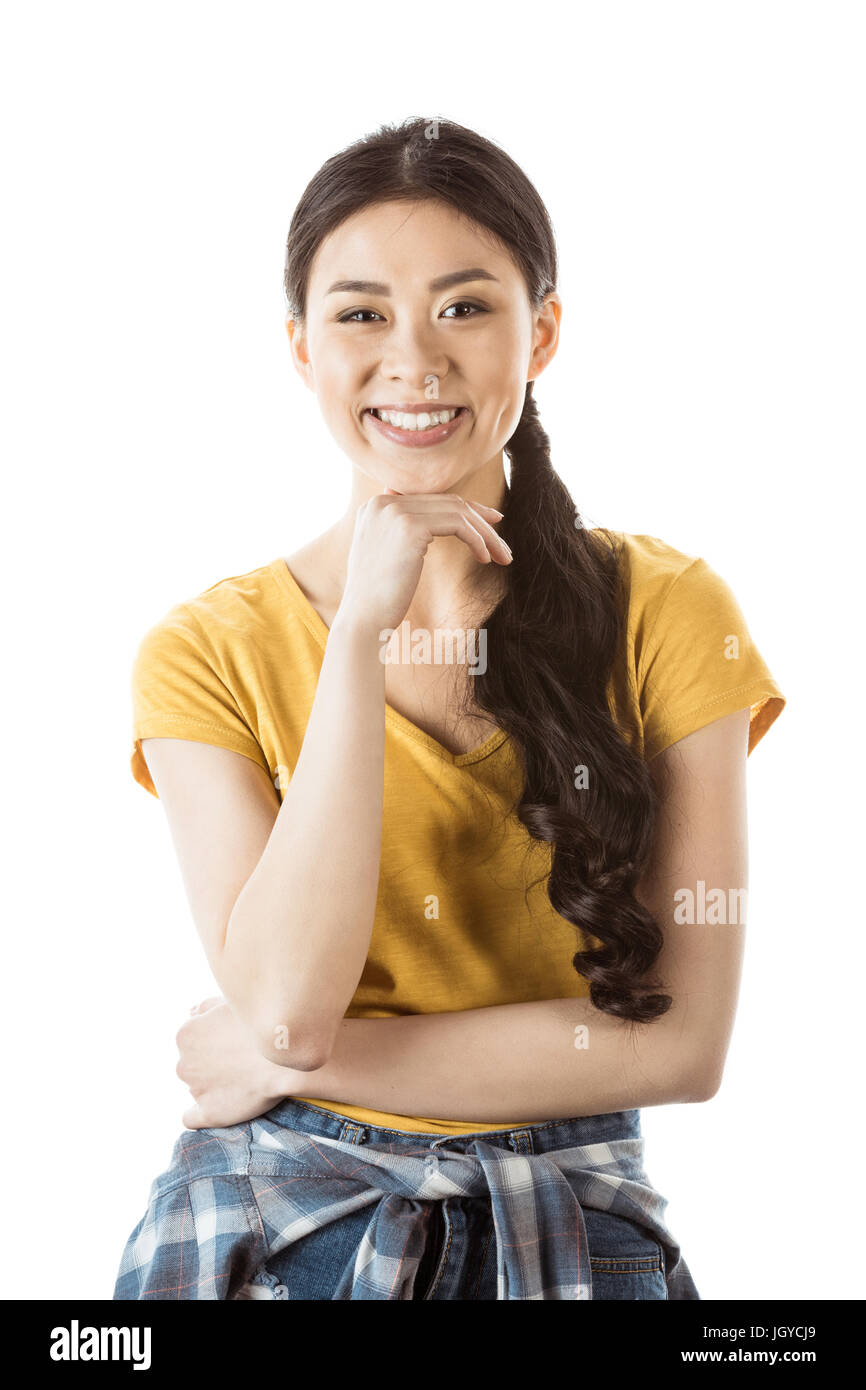 portrait of smiling asian woman with hand on chin isolated on white ...