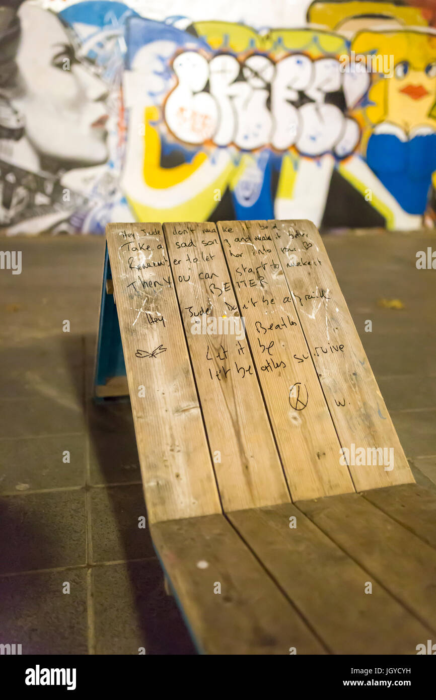 Lyrics of Hey Jude the Beatles on a bench place de la republique. Homage at the victims of the terrorist attacks in Paris the 13th of november 2015. Stock Photo