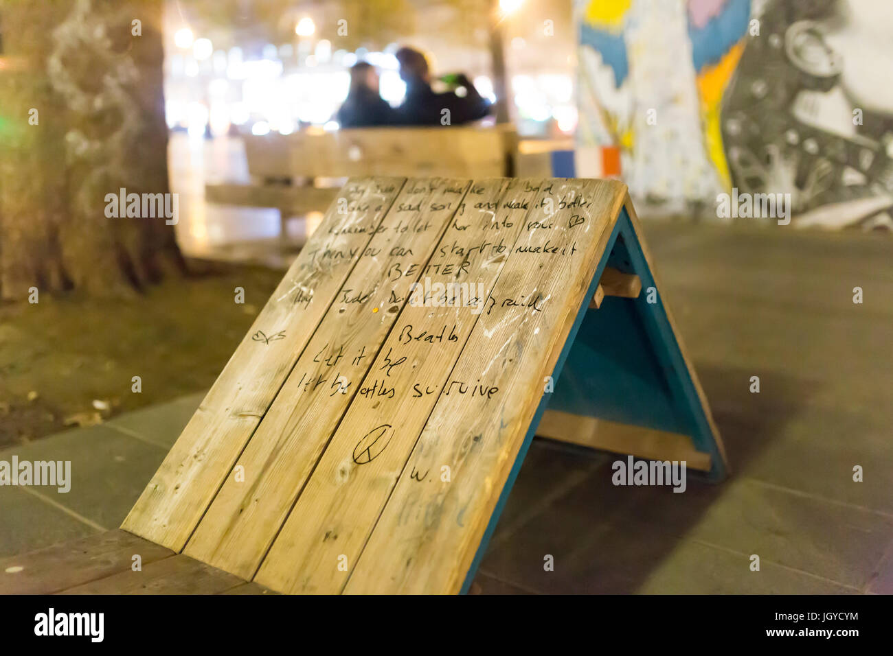 Lyrics of Hey Jude the Beatles on a bench place de la republique. Homage at the victims of the terrorist attacks in Paris the 13th of november Stock Photo