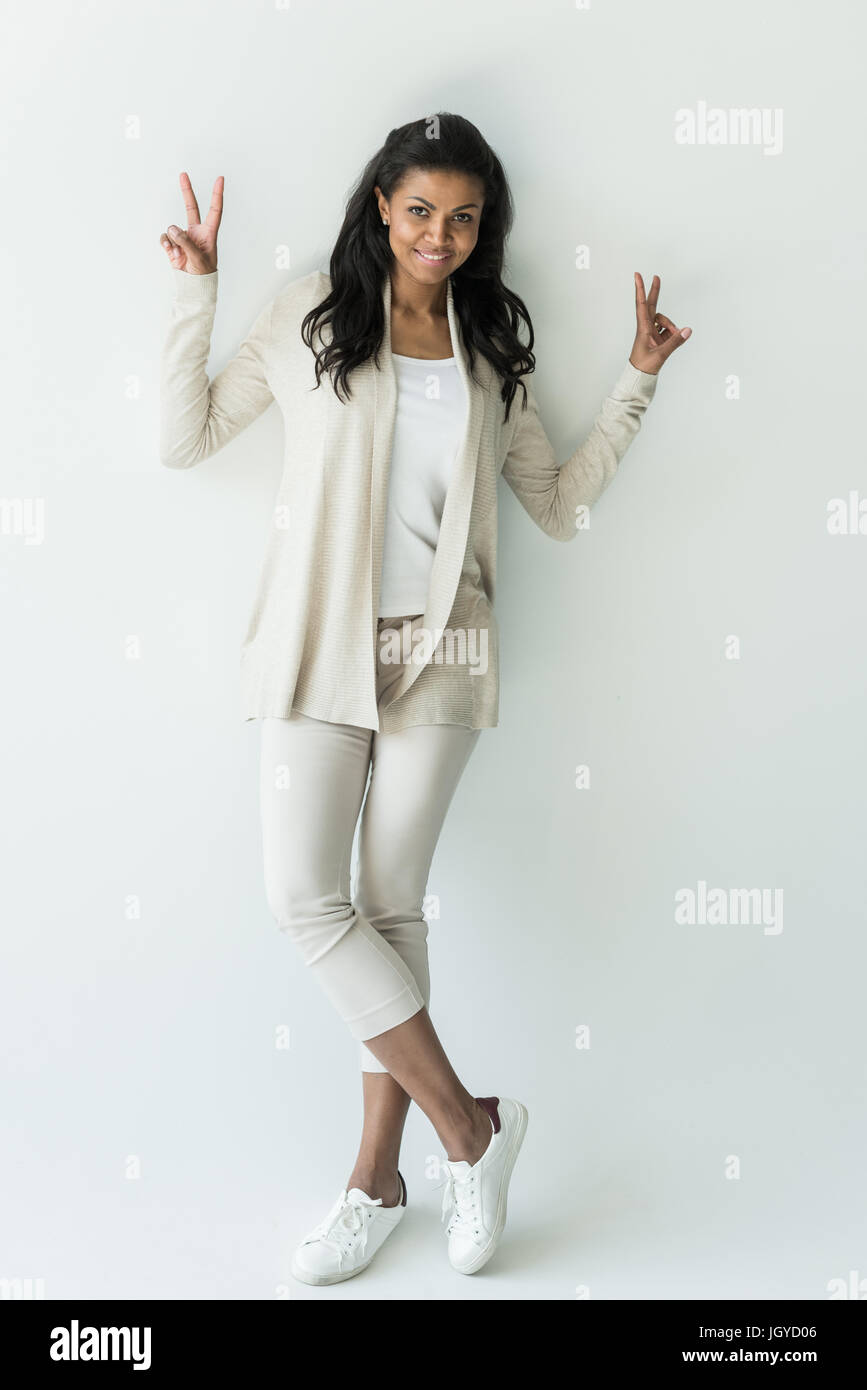 Attractive African American Woman Showing Peace Signs Isolated On White