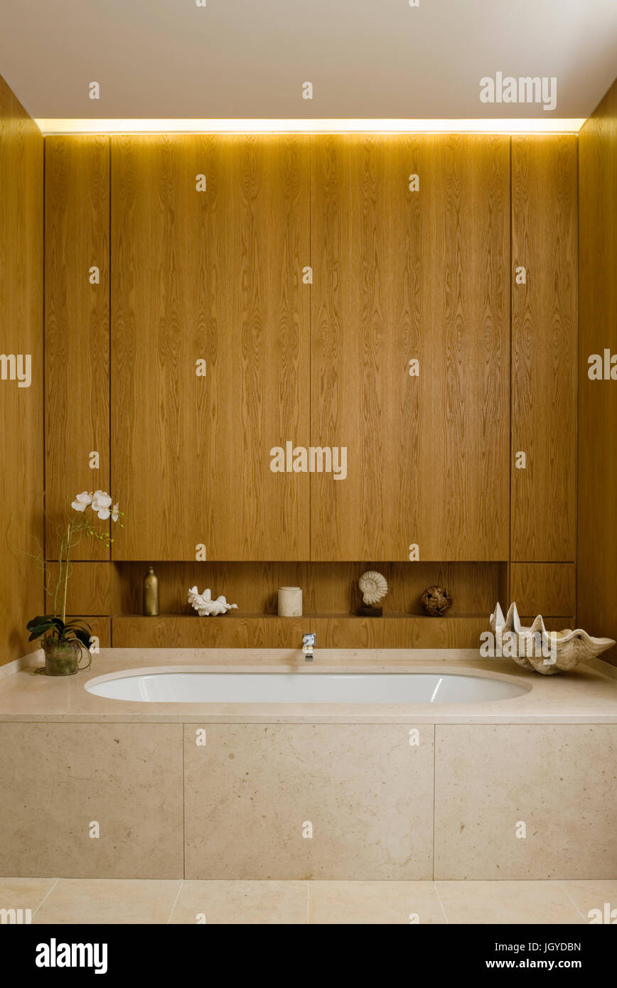 Bathtub with wood panelling and shells Stock Photo