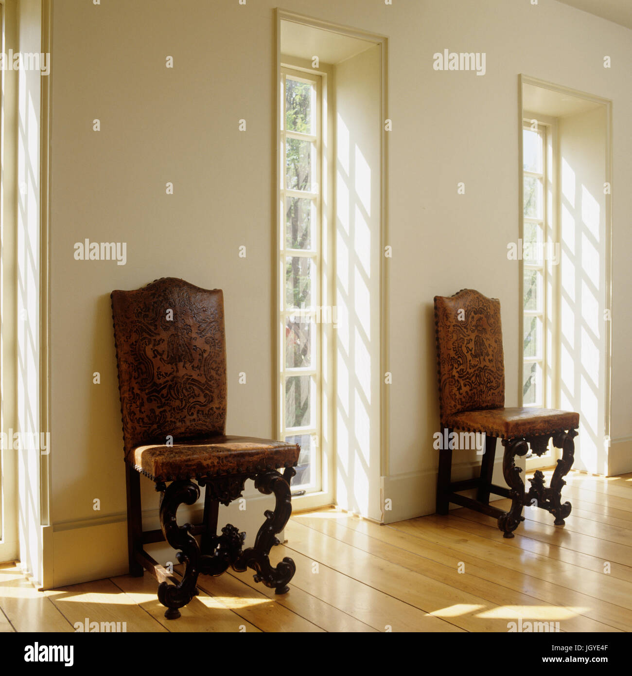 Chairs by windows Stock Photo Alamy