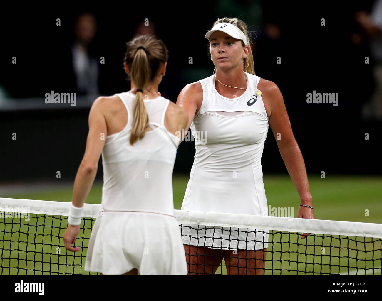 Magdalena Rybarikova and Coco Vandeweghe (right) shake hands after