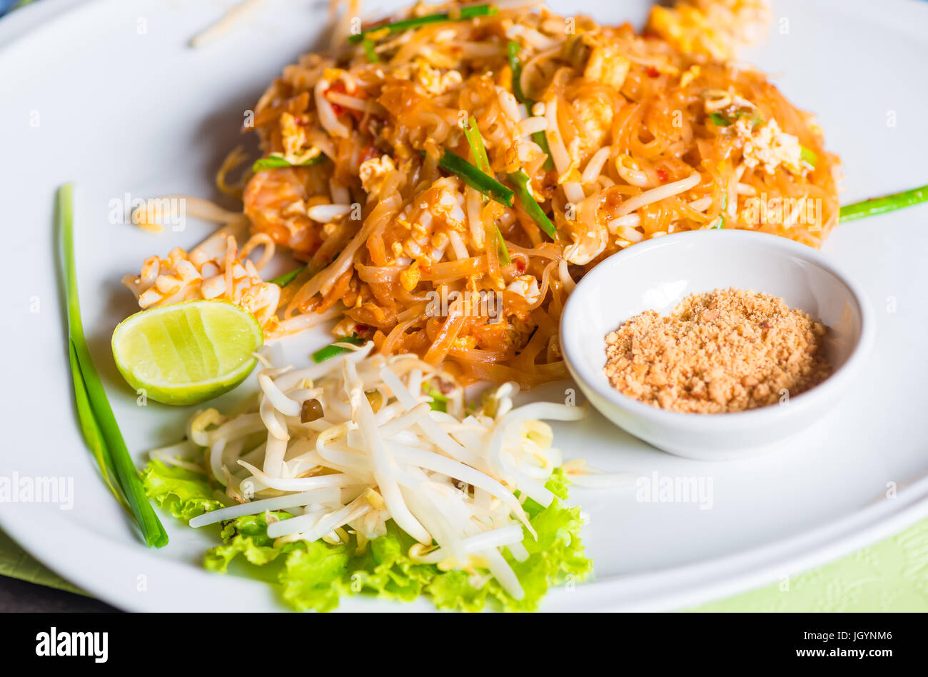 Traditional Thai dish noodles with seafood with beans on a plate Stock Photo