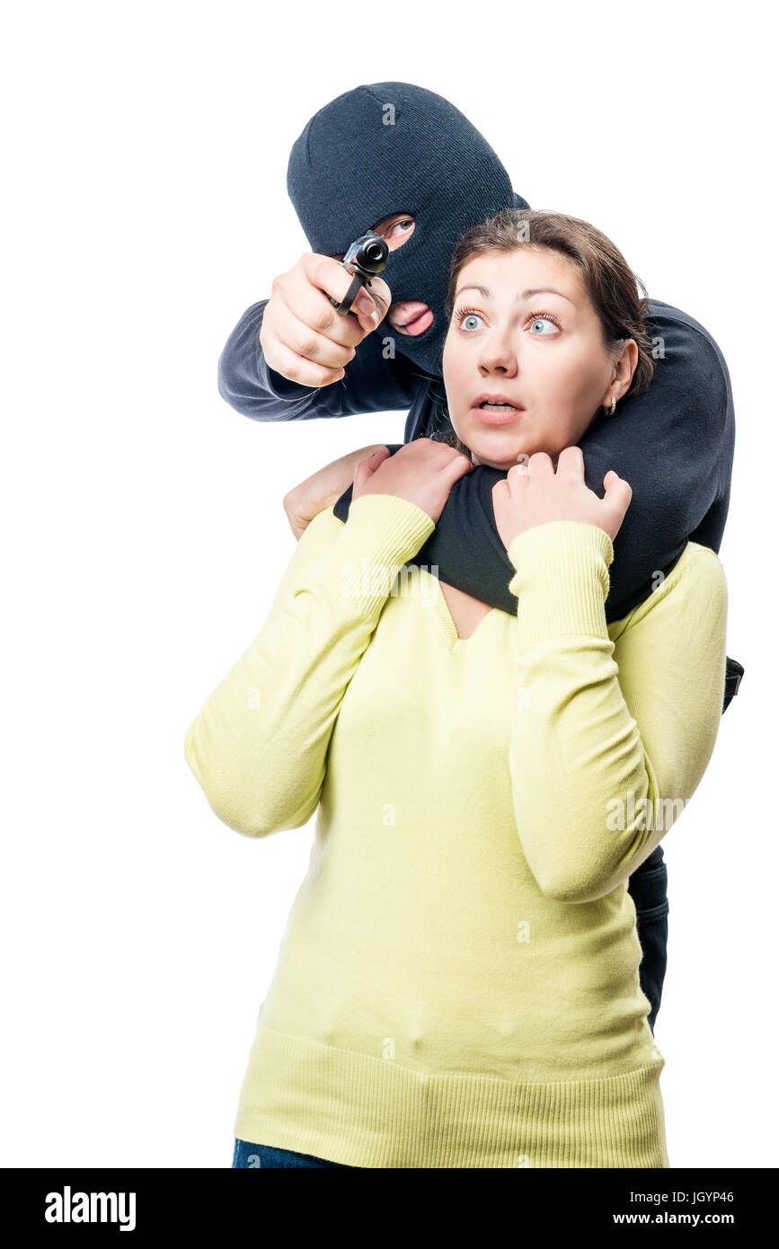 Terrorist in a balaclava with a dangerous weapon closes himself a