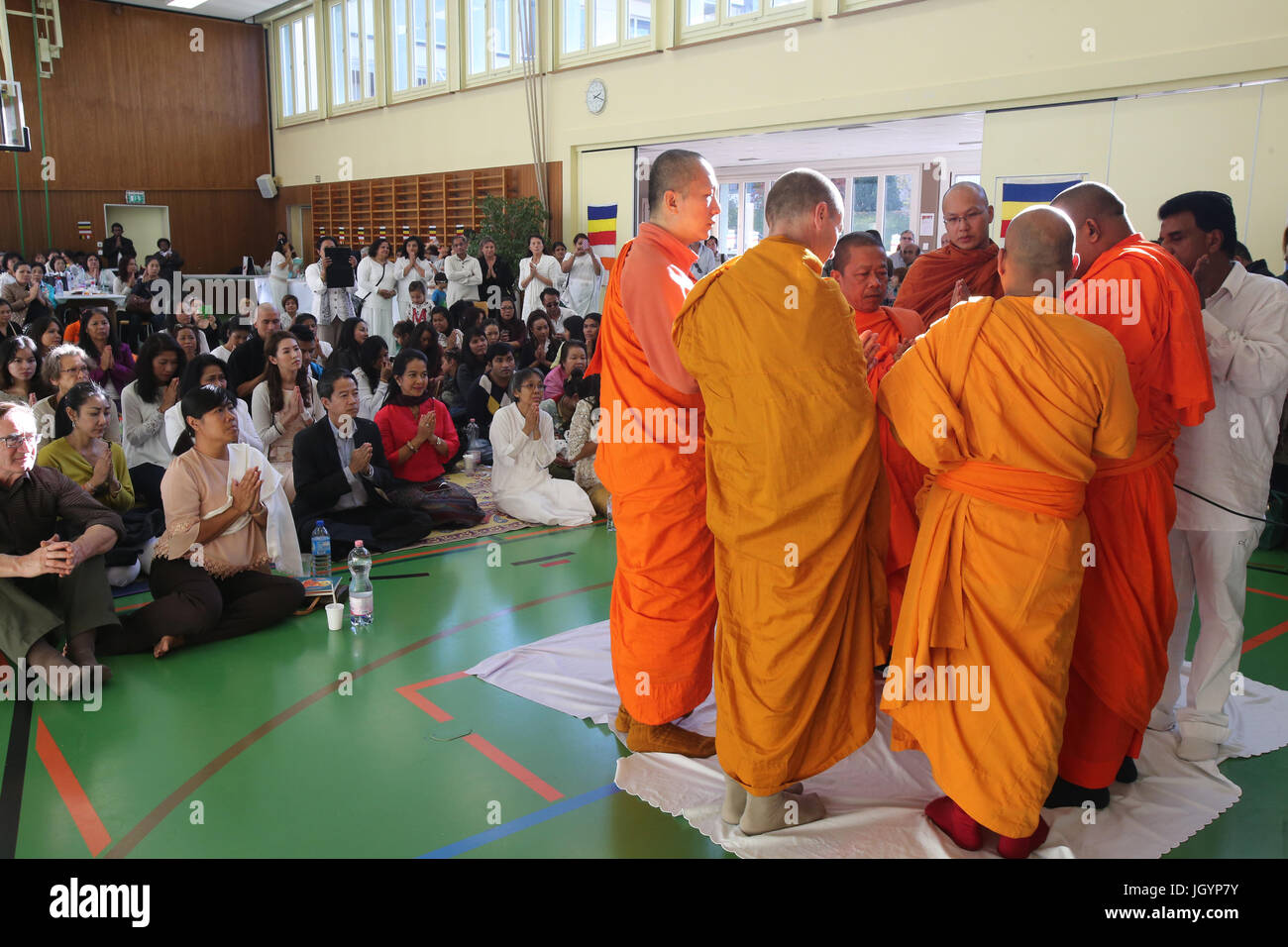Kathina ceremony : the robe offering and other necessities to the monastic sangha. Geneva. Switzerland. Stock Photo