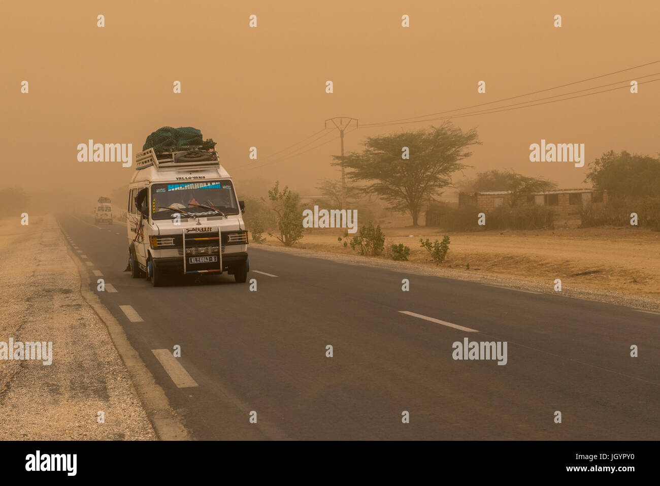 Road swept by Harmattan wind. Senegal. Stock Photo