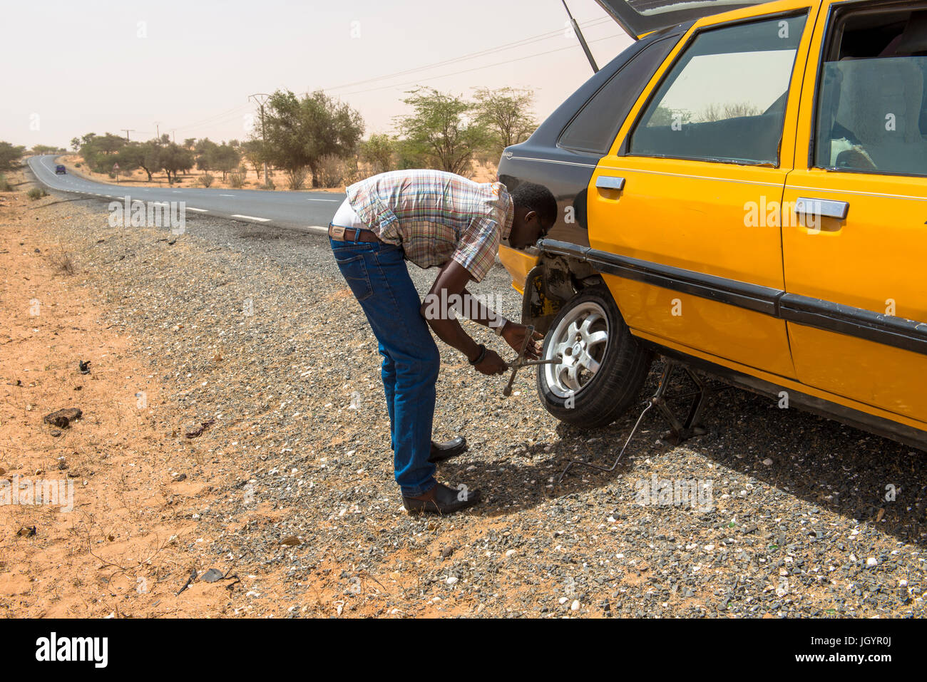 Roadside tyre repair. Senegal. Stock Photo