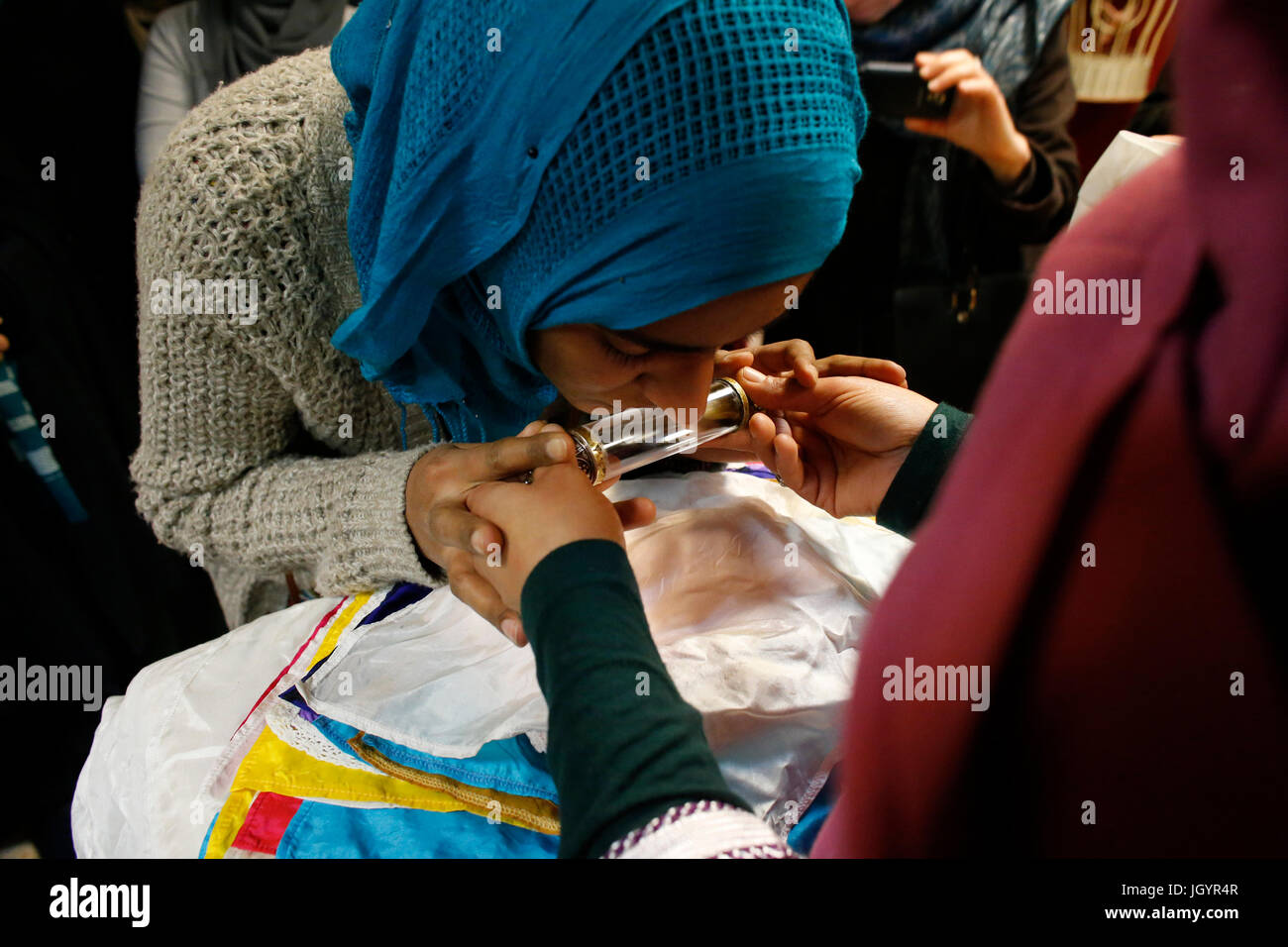 Naqshbandi sufi kissing a holy relic. France. Stock Photo