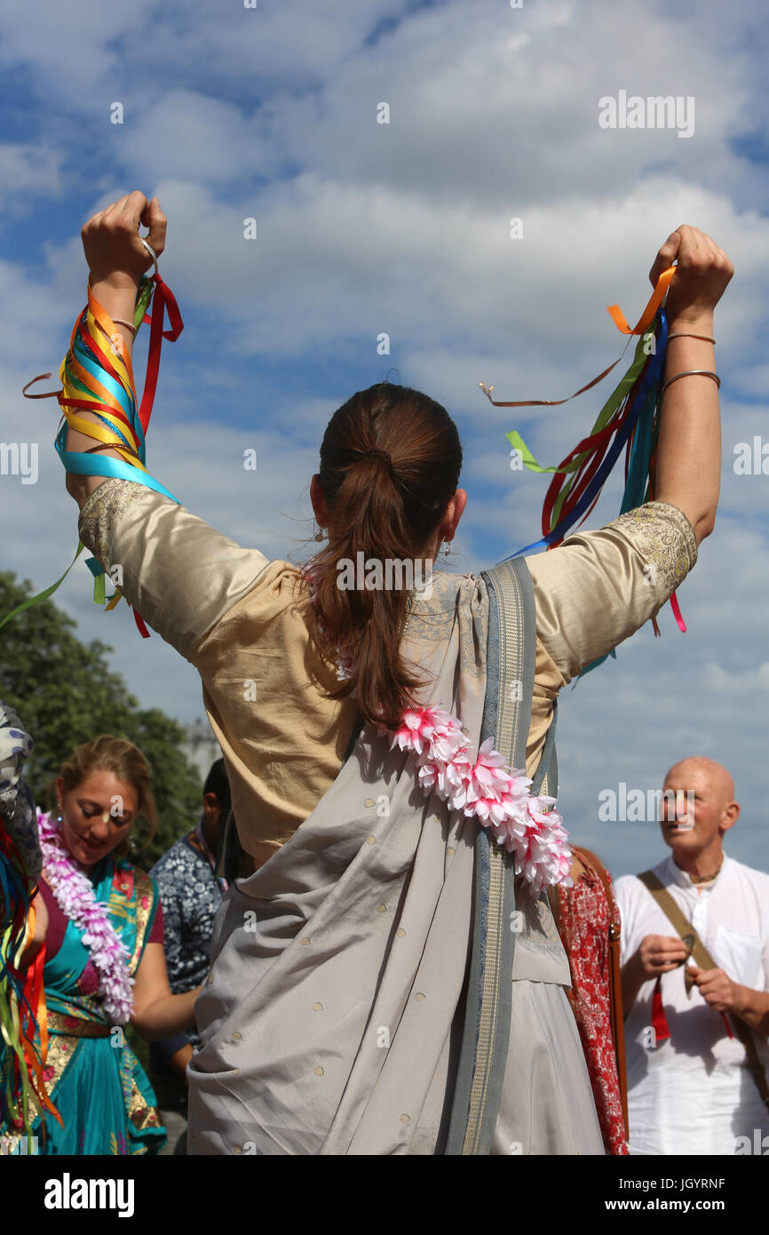 ISKCON devotees performing a harinam (devotional walk with dancing and chanting) in Paris. France. Stock Photo