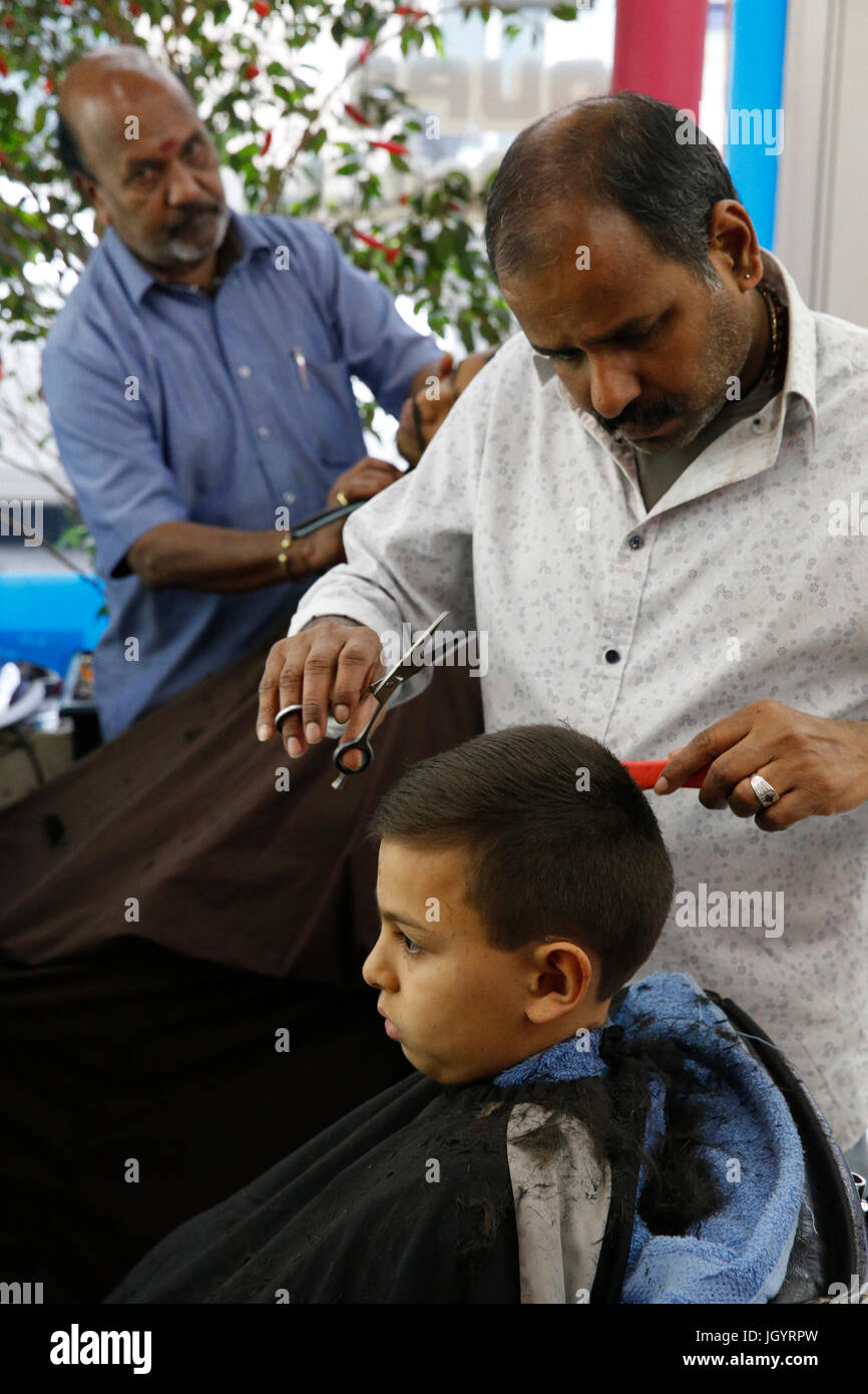 10-year-old boy getting a haircut. France. Stock Photo