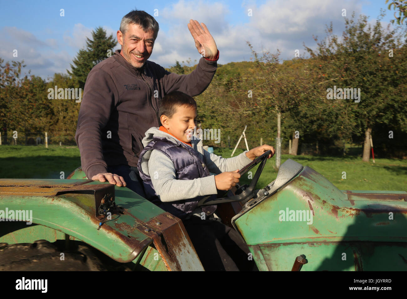 Man driving a tractor hires stock photography and images Alamy