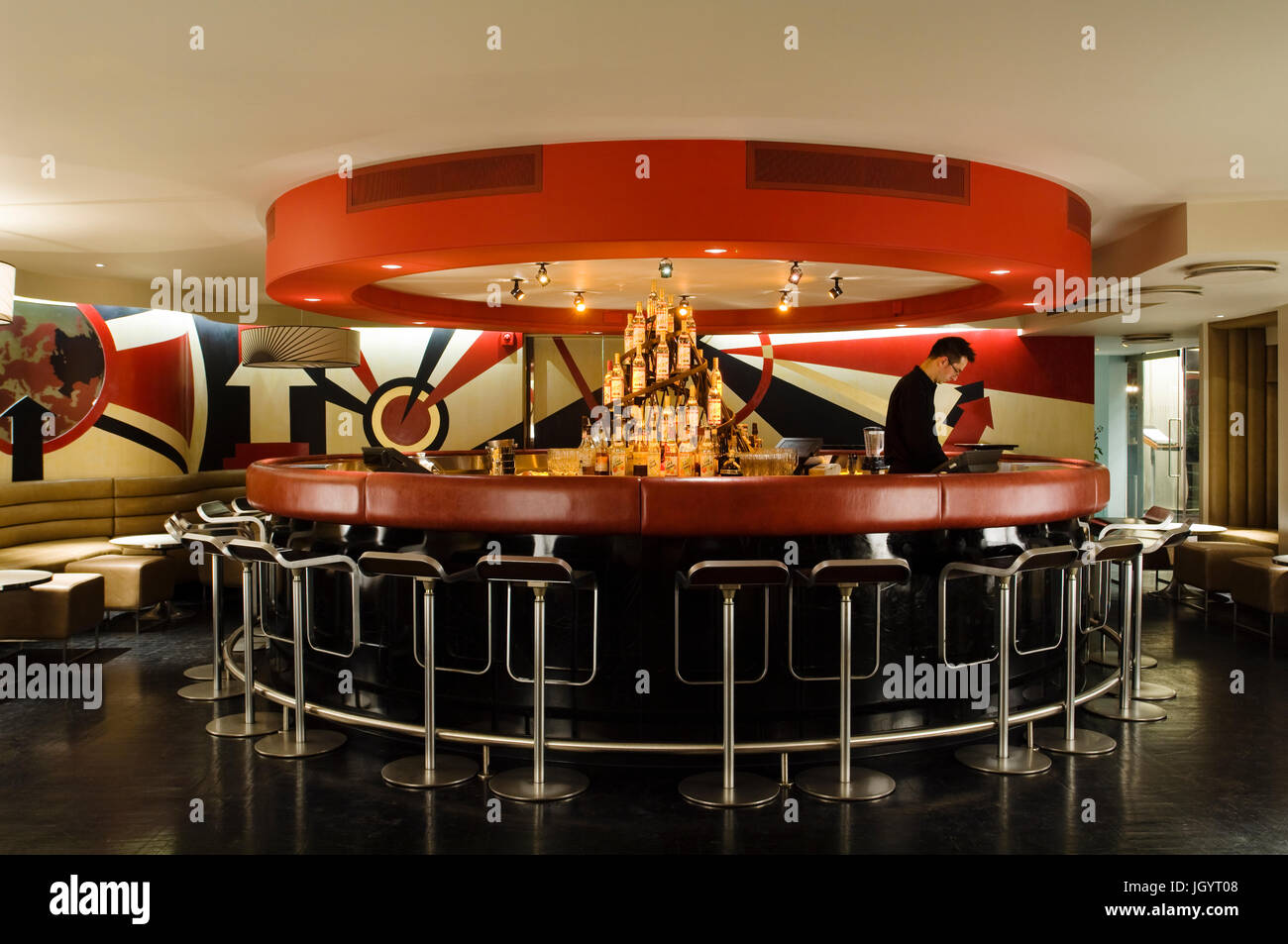 Circular red bar with black stools Stock Photo