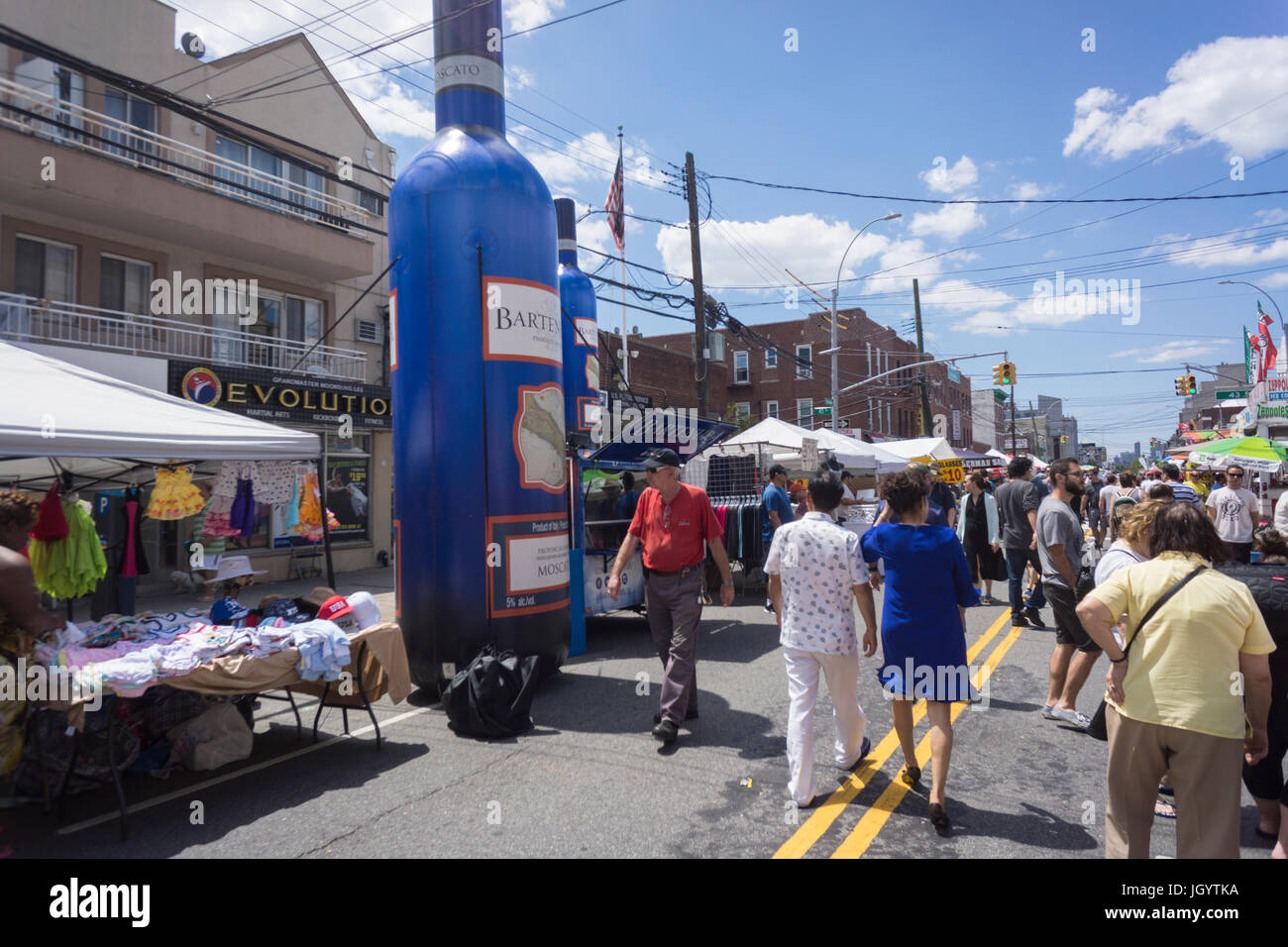 Crowds of people at a street fair in the Astoria neighborhood in Queens