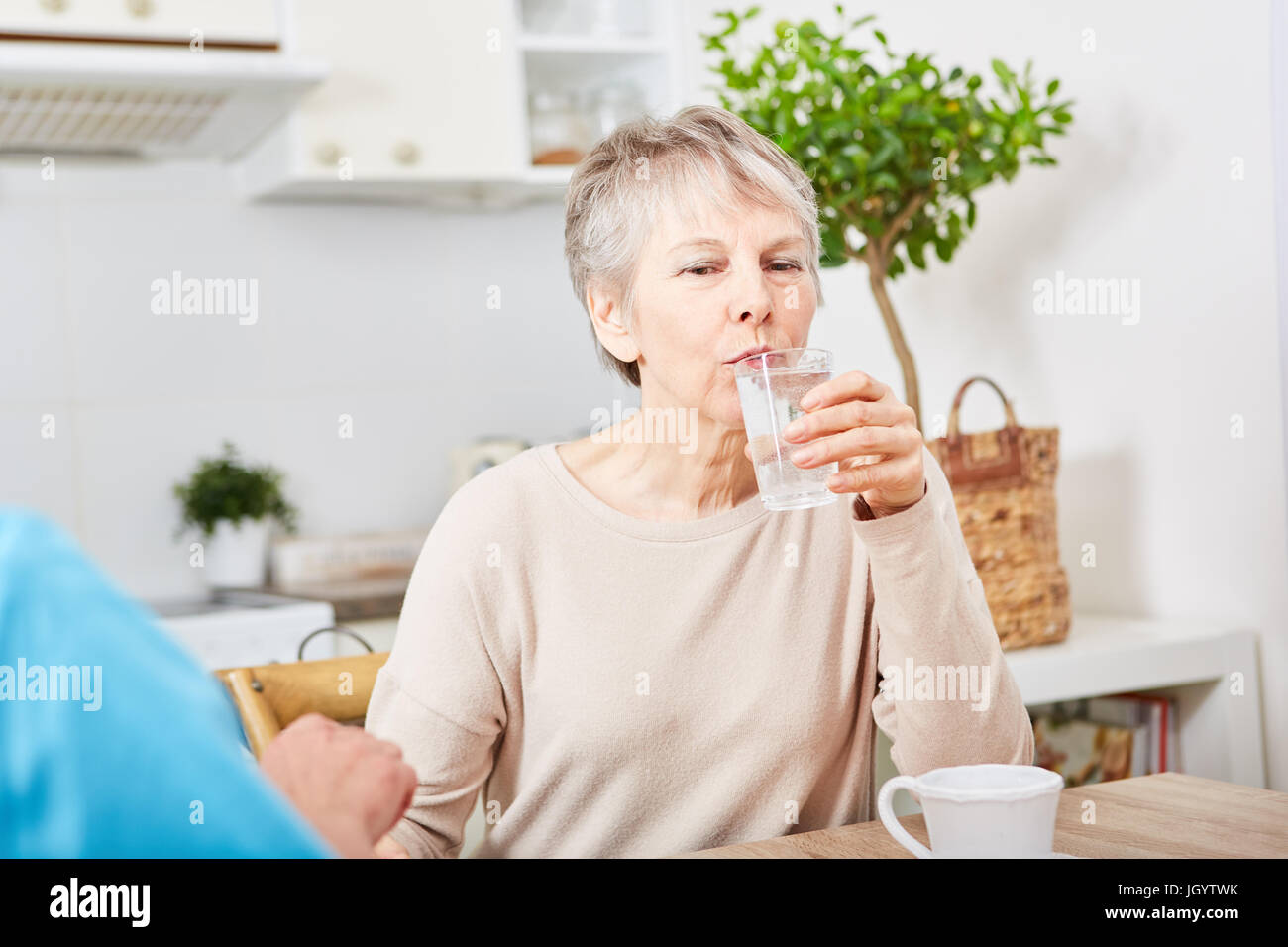 Senior woman takes her tablets for dementia therapy Stock Photo Alamy