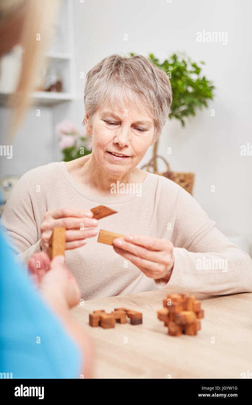 Senior woman with Alzheimers dementia making memory training excercise