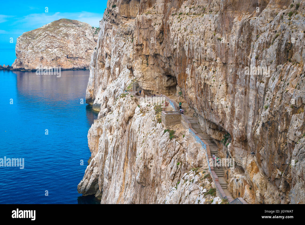 Grotta di Nettuno Sardinia, tourists head for the entrance to the Grotta di Nettuno near Alghero by way of the 654 step cliff-side staircase,Sardinia. Stock Photo