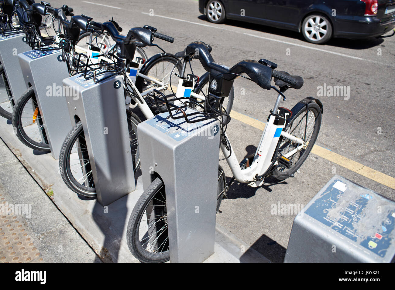Rental of electric bicycles in the city Stock Photo Alamy