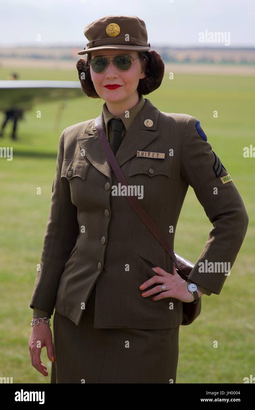 A young lady dressed in period uniform at the Flying Legends Air Show 2017 Stock Photo