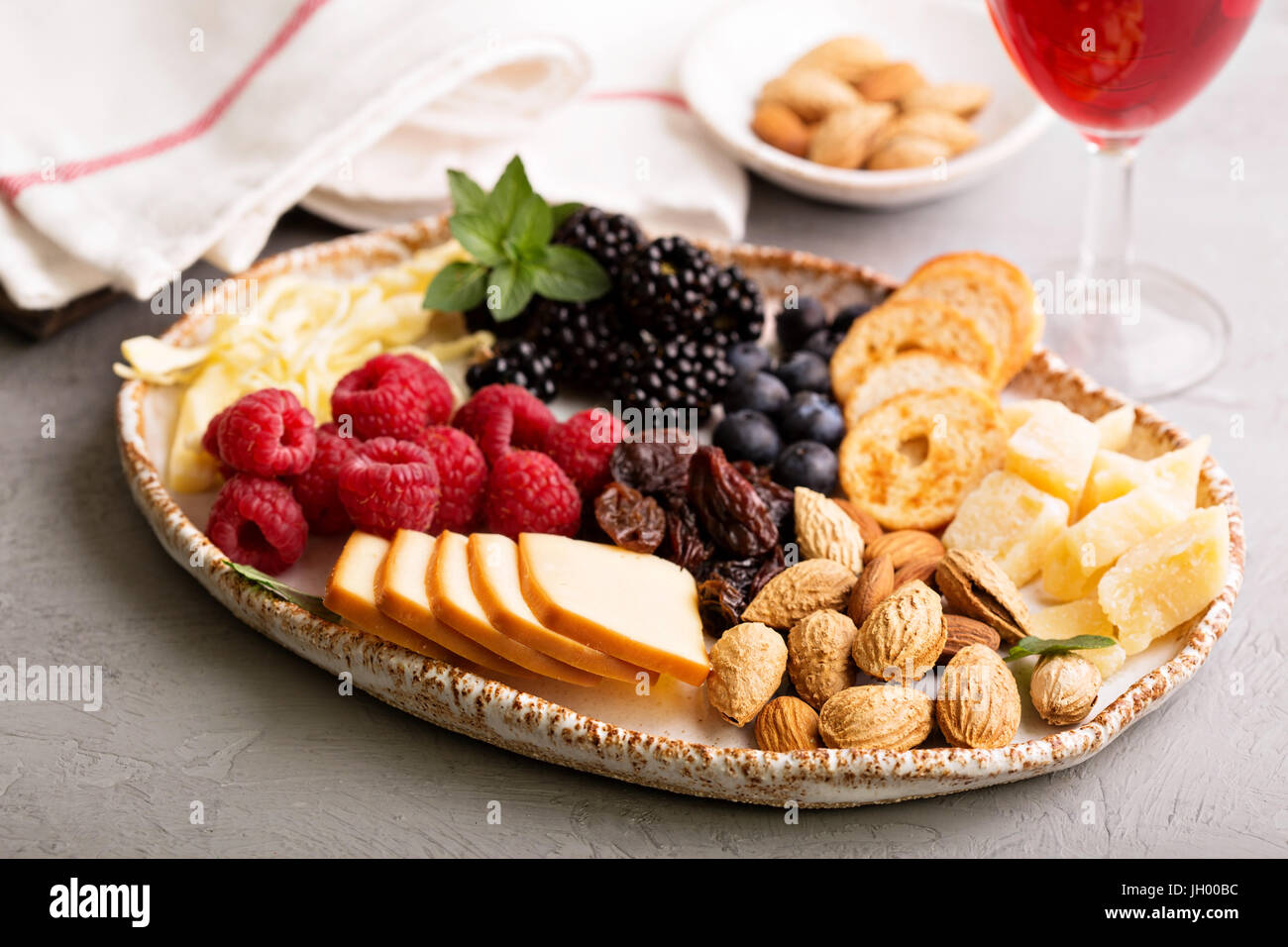 Cheese plate with nuts and berries Stock Photo Alamy