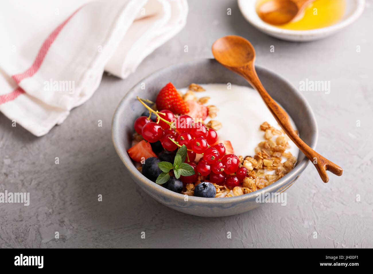 Yogurt bowl with granola and fresh berries Stock Photo