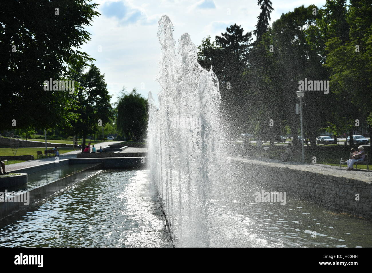 colored water fountain in the city park in the night Stock Photo - Alamy