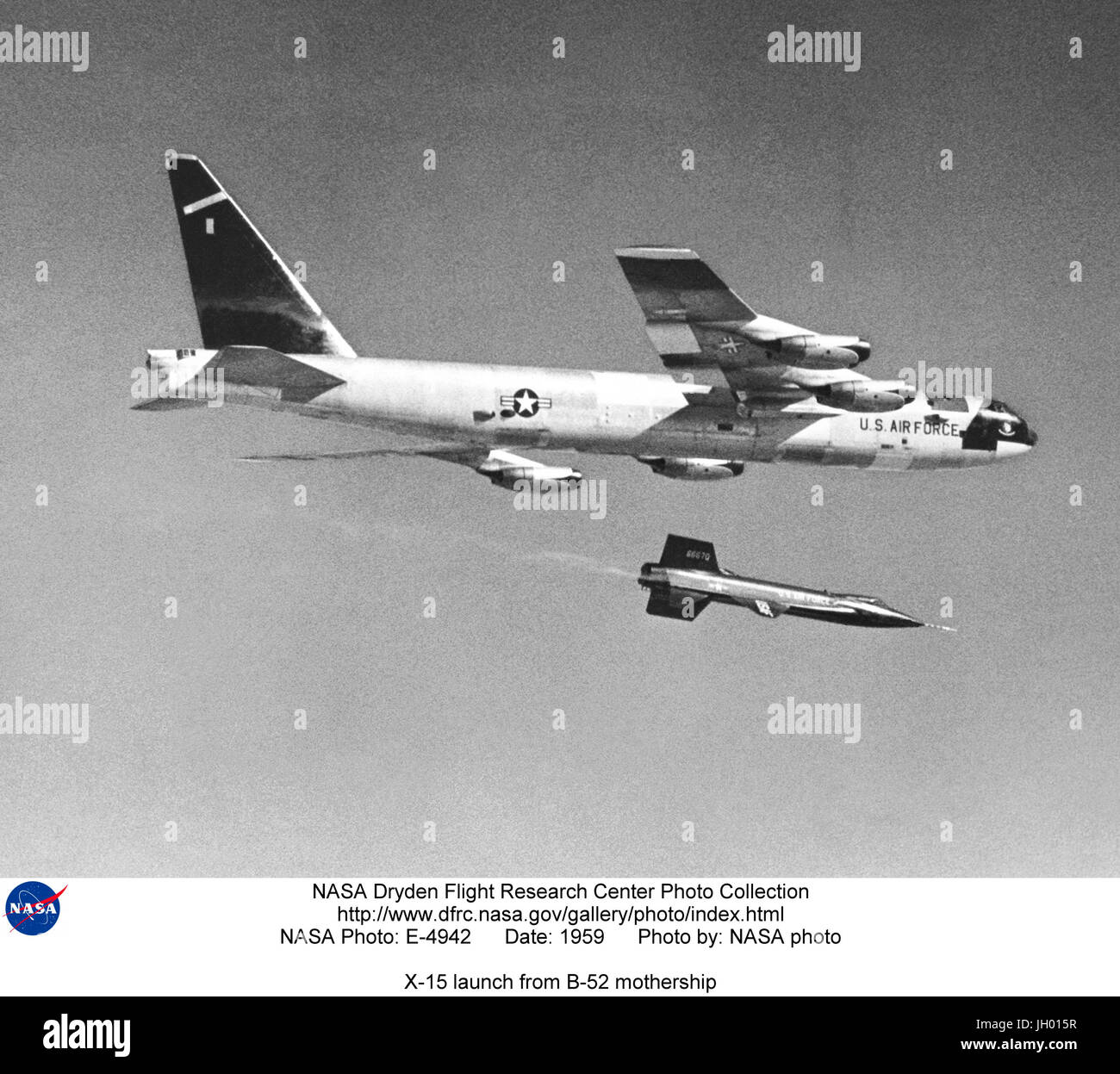 This photo illustrates how the X-15 rocket-powered aircraft was taken aloft under the wing of a B-52. Because of the large fuel consumption, the X-15 was air launched from a B-52 aircraft at 45,000 ft and a speed of about 500 mph. This was one of the early powered flights using a pair of XLR-11 engines (until the XLR-99 became available). Stock Photo