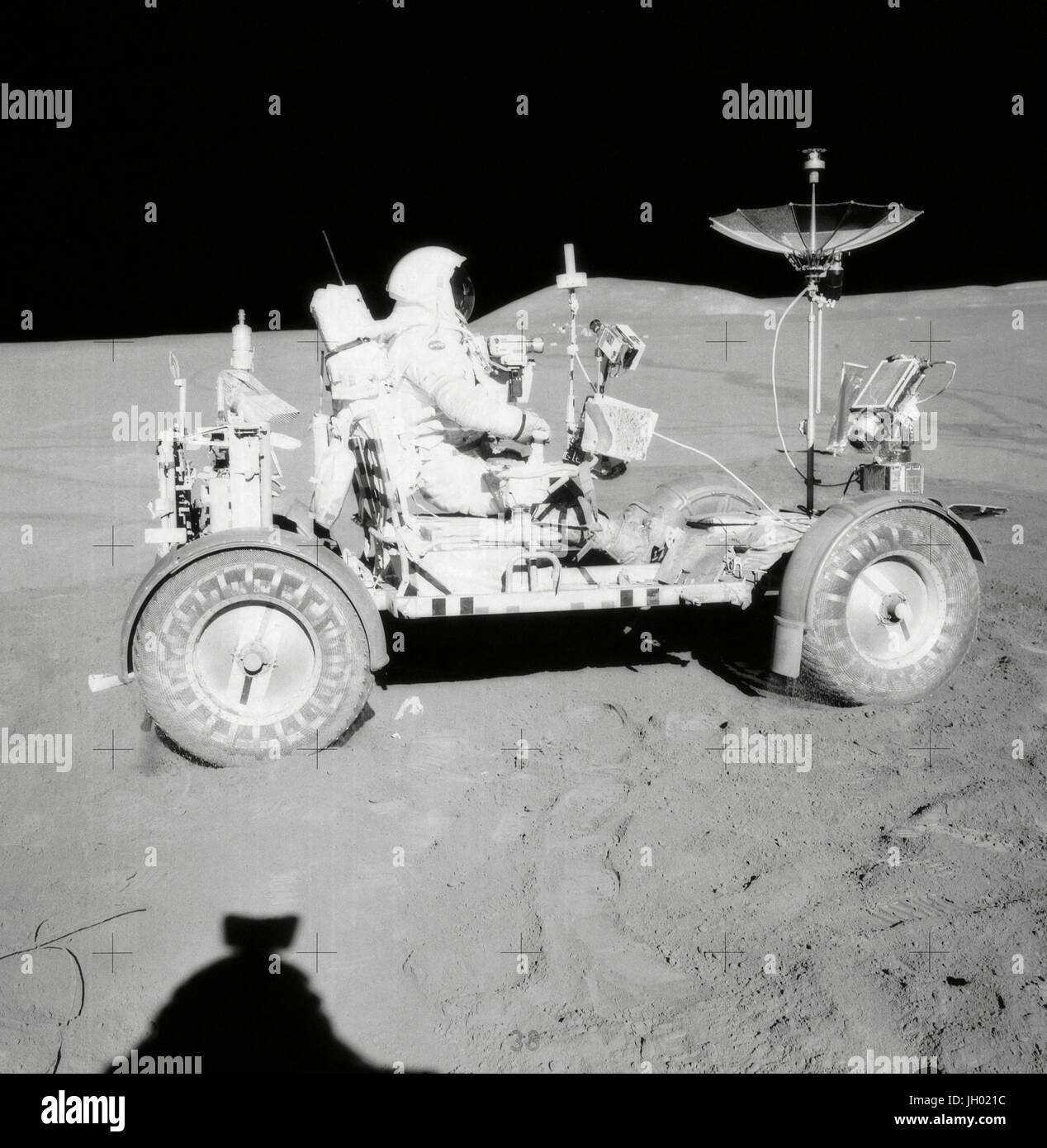 Scott on the Rover. David R. Scott, Apollo 15 Commander, is seated in the Rover, Lunar Roving Vehicle (LRV) during the first lunar surface extravehicular activity (EVA-1) at the Hadley-Apennine landing site. Photographer: NASA James B. Irwin Stock Photo