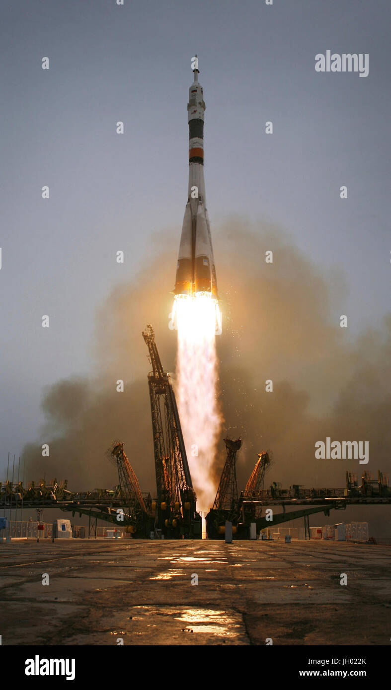 The Soyuz TMA-14 launches from the Baikonur Cosmodrome in Kazakhstan on Thursday, March 26, 2009, carrying Expedition 19 Commander Gennady I. Padalka, Flight Engineer Michael R. Barratt and spaceflight participant Charles Simonyi to the International Space Station. Image Credit: NASA/Bill Ingalls Stock Photo