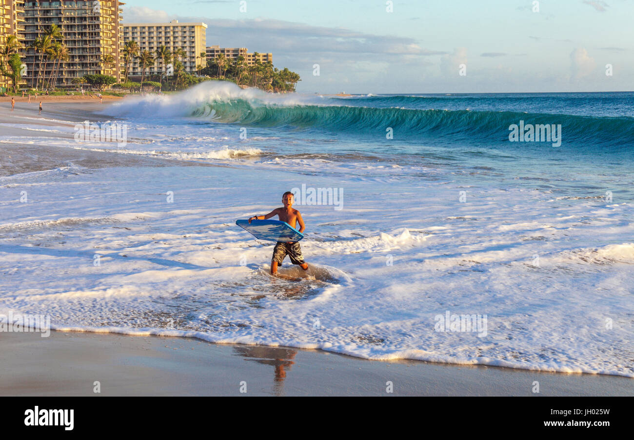 Boy with skimboard at Kaanapali Beach on Maui Stock Photo Alamy