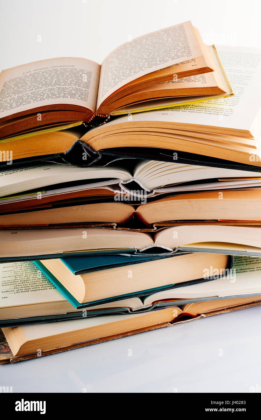 Pile of books of literature, reading magnify. Stock Photo