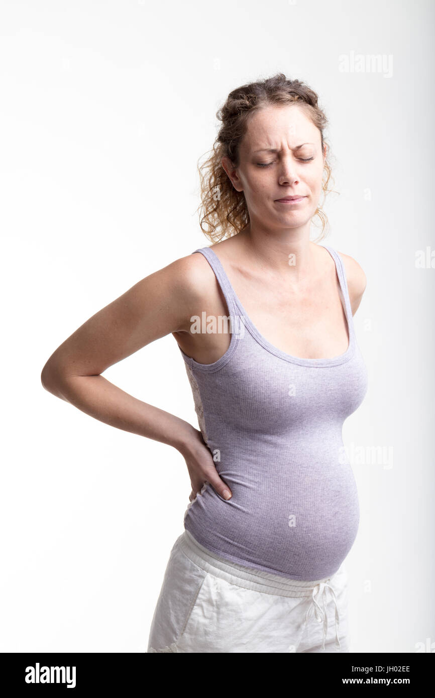 woman suffering Backache during pregnancy on a white background Stock Photo Alamy
