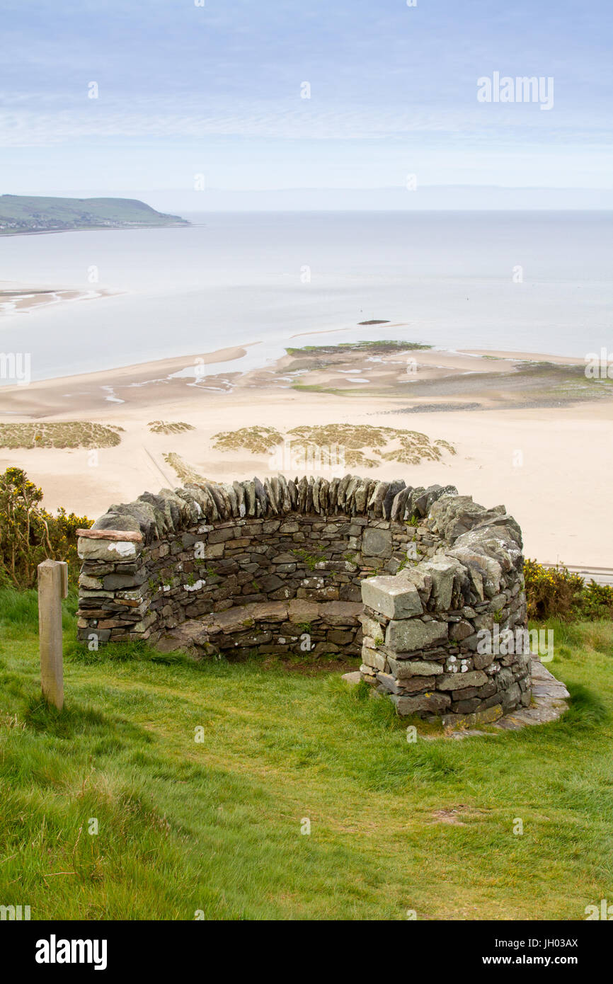 Upright shot of old fort stone look out and Barmouth beach and sea behind, a beautiful Welsh coastal landscape Stock Photo