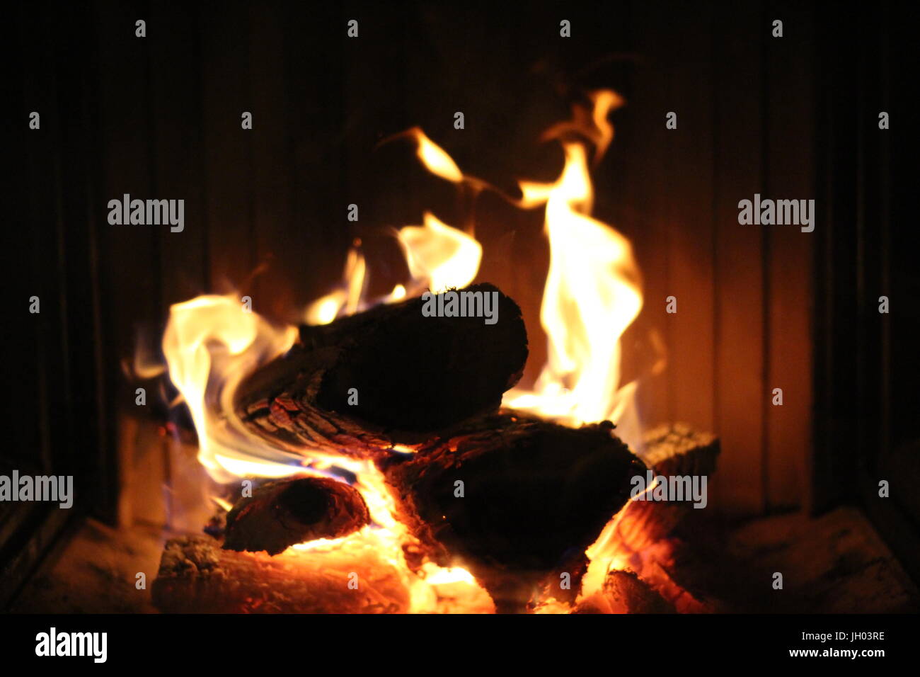 Fire burning in a chimney Stock Photo Alamy