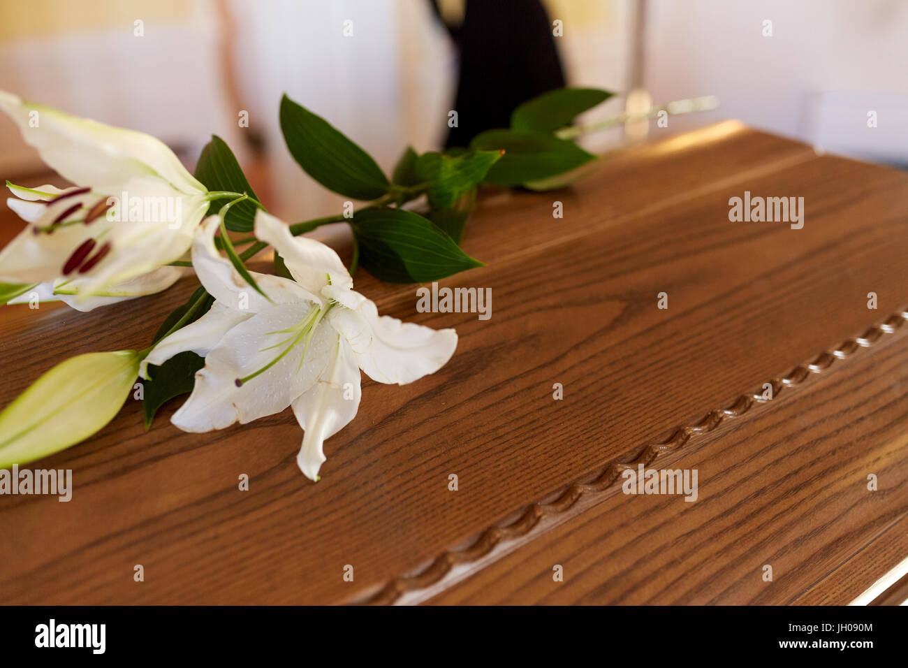 lily flower on wooden coffin at funeral in church Stock Photo Alamy